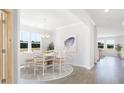 Bright dining room with natural light and modern chandelier at 1051 Tea Time Dr, Summerville, SC 29485