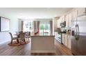 Bright kitchen with granite countertops, stainless steel appliances, and adjacent breakfast nook at 136 Haventree Ct, Summerville, SC 29486
