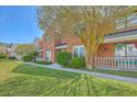 Attractive brick townhouse showcasing the front facade, yard, and well-kept landscaping at 1421 Dove Run Dr # C, Charleston, SC 29412
