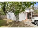 Spacious two-car garage with additional storage space and access to the side yard and back patio at 181 Commons Way, Goose Creek, SC 29445