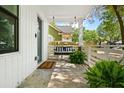 Charming front porch with a porch swing and plenty of room to relax on a sunny day at 2122 Commander Rd, North Charleston, SC 29405