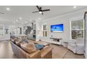 Bright living room featuring wood floors, ceiling fan, and an open floor plan at 2568 Hatch Dr, Johns Island, SC 29455