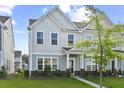 Charming two-story townhome with a well-maintained lawn and inviting entrance at 258 Godwit Dr, Summerville, SC 29486