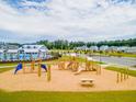 Modern playground with climbing structures, slides, and picnic tables nestled within a community at 290 Watersglen Dr, Summerville, SC 29486