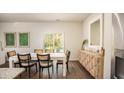 Dining room showcasing stylish furniture, wood flooring, and a sliding glass door to the backyard patio at 329 Pine Crest View Dr, Summerville, SC 29486