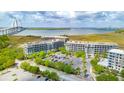 Beautiful aerial view showcasing condo buildings near the water with ample parking and the Ravenel Bridge backdrop at 341 Cooper River Dr, Mount Pleasant, SC 29464