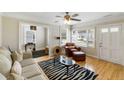 Bright living room with hardwood floors, zebra-striped rug, and stylish decor at 3728 Tim St, North Charleston, SC 29405