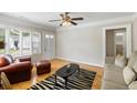 Inviting living room features hardwood floors, a ceiling fan, and neutral decor at 3728 Tim St, North Charleston, SC 29405