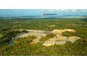 Panoramic aerial view of the new housing community with scenic lakefront, walking trails, and vast green spaces at 406 Peachwood Ln, Moncks Corner, SC 29461