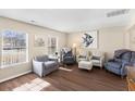 Bright and spacious living room featuring stylish furniture, hardwood floors, and plenty of natural light at 407 Burton Ave, Summerville, SC 29485