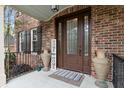 Charming front entrance with a decorative glass door, brick facade, and stylish decor elements at 4217 Sawgrass Dr, Charleston, SC 29420