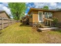 Spacious backyard with thriving green grass and a wooden fence at 100 Nighthawk Ln, Summerville, SC 29485