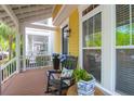 Cozy front porch featuring a rocking chair, plants, and view of the neighborhood at 1243 Appling Dr, Mount Pleasant, SC 29464