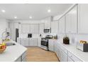 Modern kitchen with stainless steel appliances, sleek countertops, ample storage, and light-gray cabinets at 147 Threaded Fern St, Summerville, SC 29485