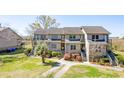 Attractive condo exterior with well-maintained landscaping and a welcoming walkway, enhancing the property's charm at 165 River Breeze Dr, Charleston, SC 29407