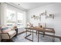 Bright home office featuring a modern desk, stylish decor, and large windows at 261 Camellia Bloom Dr, Moncks Corner, SC 29461