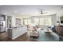 Open concept living room with stainless steel appliances and a view to the dining area at 261 Camellia Bloom Dr, Moncks Corner, SC 29461
