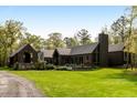 Beautiful modern home on large lot with lush lawn and thoughtful landscaping at 2885 Plow Ground Rd, Johns Island, SC 29455