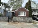 Exterior of a charming brick home with landscaped yard at 3 Woodall Ct, Charleston, SC 29403