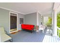 Inviting porch with comfortable seating, a dark wood door, and a relaxing ambiance at 3030 Baltimore St, Charleston, SC 29492