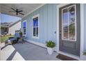 Cozy front porch featuring comfortable seating, ideal for relaxing outdoors at 310 Ripple Park Dr, Summerville, SC 29486