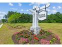 Stone Ridge community entrance sign with colorful flowerbed at 369 Spruce Ivy St, Moncks Corner, SC 29461