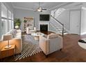 Bright living room features a fireplace, stairs, neutral colors, and stylish furniture at 3700 Maidstone Dr, Mount Pleasant, SC 29466