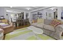 Spacious living room with modern decor and an open layout, ideal for both relaxation and social gatherings at 4971 Edge Ave, Charleston, SC 29405