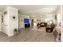 Spacious living room with hardwood floors, neutral walls, and cozy furniture at 10032 Randall, McClellanville, SC 29458