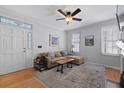 Bright living room with a comfortable sofa, decorative artwork, and natural light at 108 Smith St # 108-I, Charleston, SC 29403