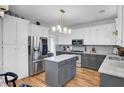 Updated kitchen features stainless steel appliances, granite countertops, and a center island at 123 Dasharon Ln, Goose Creek, SC 29445