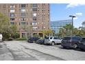 Exterior shot of a building and the adjacent parking lot with parked vehicles at 14 Lockwood Dr # 6E, Charleston, SC 29401