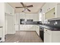 Traditional eat-in kitchen with a ceiling fan, tile floors, and ample cabinetry at 1501 Birthright St, Charleston, SC 29407