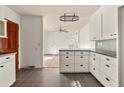 Spacious kitchen area features lots of cabinet storage and hardwood flooring in the dining room at 1501 Birthright St, Charleston, SC 29407