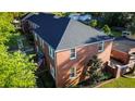 Brick exterior of the two-story residence showcases classic architecture and mature landscaping at 17 8Th Ave # 17G, Charleston, SC 29403