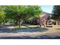 Charming brick building on a tree-lined street with well-maintained lawns and walkways at 17 8Th Ave # 17G, Charleston, SC 29403