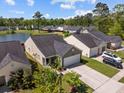 Aerial view of a home near a pond, showcasing its proximity to nature and well-maintained surroundings at 187 Brittondale Rd, Summerville, SC 29485