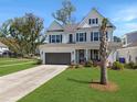 Two-story house with a well-kept lawn, two-car garage, and beautiful trees at 2823 Dearmin Dr, Mount Pleasant, SC 29466