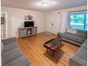 Spacious living room featuring hardwood floors, comfortable seating, and a cozy atmosphere at 306 Fairlawn Drive, Moncks Corner, SC 29461