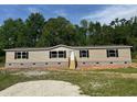 Charming single-story home with neutral siding, black shutters, and inviting front steps at 320 Bedford Rd, Cross, SC 29436