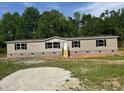 Charming single-story home with neutral siding, black shutters, and inviting front steps at 320 Bedford Rd, Cross, SC 29436