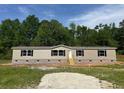 Charming single-story home with neutral siding, black shutters, and inviting front steps at 320 Bedford Rd, Cross, SC 29436