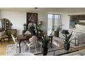 Open-concept living room with dining area, features hardwood floors, natural light, and stylish furnishings, enhancing the airy and spacious feel at 330 Concord St # 4B, Charleston, SC 29401