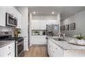 Beautiful kitchen with white cabinetry, a stainless steel fridge, and granite countertops at 337 Pine Crest View Dr, Summerville, SC 29486