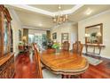 Elegant dining room featuring a hardwood floor, a chandelier, and views into the adjacent living spaces at 3502 Stockton Dr, Mount Pleasant, SC 29466