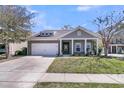 Charming brick home with well-maintained lawn, mature trees, and a two-car garage at 3968 Hanoverian Dr, Mount Pleasant, SC 29429