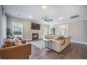 Cozy living room features a fireplace, comfortable leather furniture, and modern decor at 4332 John Hatch Dr, Johns Island, SC 29455