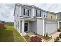 Two-story home featuring a well-maintained front yard, and a two-car garage with gray vinyl siding at 470 Spectrum Rd, Summerville, SC 29486