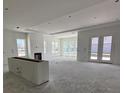 Bright, open living room with large windows, featuring a fireplace and access to an outdoor area at 625 Marsh Cove Cir, Summerville, SC 29486