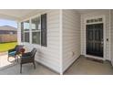 Cozy porch with seating offers a welcoming entrance, framed by stylish siding and decorative shutters at 706 Squire Pope Rd, Summerville, SC 29486